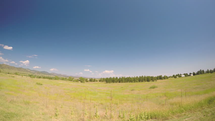 Car driving through grassland at Chatfield State Park.-POV point of view.