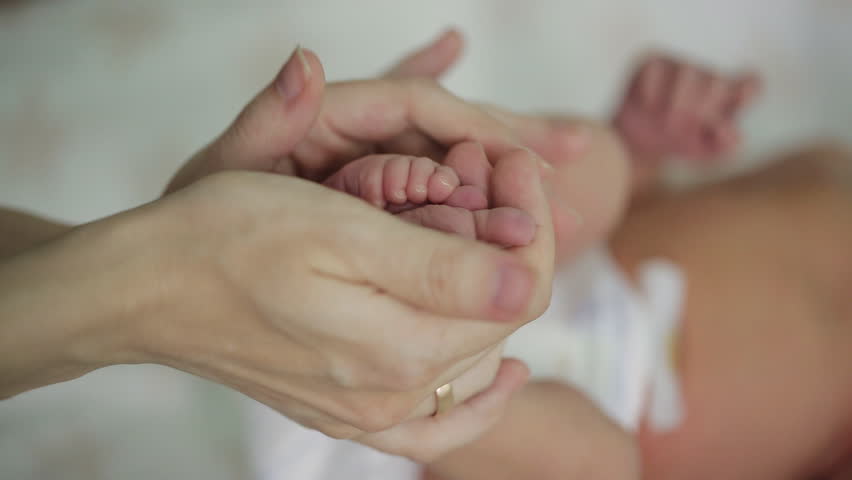 Little feet a newborn baby | Shutterstock HD Video #17805928