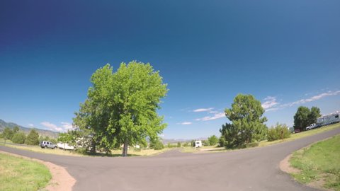 Denver, Colorado, USA-July 4, 2016. Car driving through campground with motorhomes at Chatfield State Park.-POV point of view.