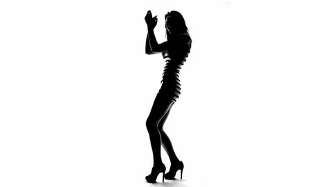 Silhouette of a sexy woman in high heels dancing with her hands raised, on white