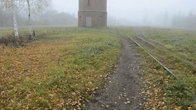 old tower in the derelict railway station and morning mist