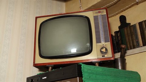 bottom view, Retro TV on the refrigerator, a corner of the room, bookshelf