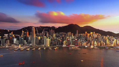 Sunset over Hong Kong island time lapse. Urban cityscape 4K panorama background