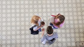 Overhead view of a group of high school students chatting in the hallway. 