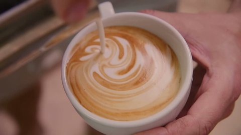 Making of cafe latte art, heart shape