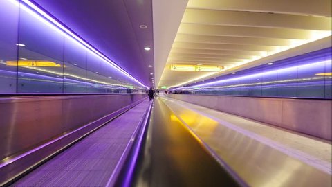 LONDON - 18 May 2016 : Walking with elevator Inside Heathrow Airport Terminal on May 18, 2016 in London, England Hyperlapse. London Heathrow Airport is the largest airport in the United Kingdom.
