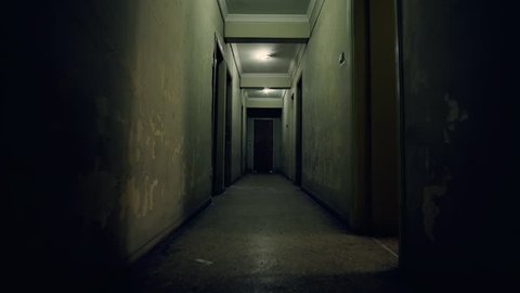 Old apartment building,long dark hallway.Tracking in on the corridor of an old apartment building,long and dark hallway.