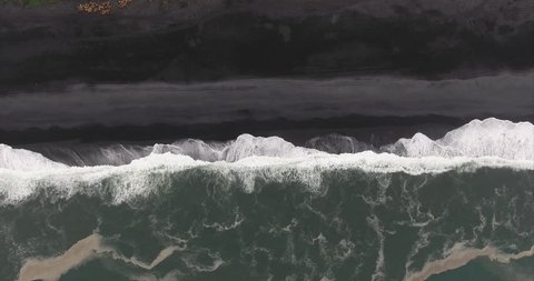 Stationary Overhead Shot Of Seashore At Black Sand Beach in V\xCC_k \xCC_ M\xCC_rdal Iceland