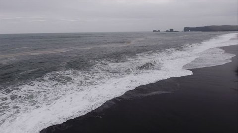Flying Alongside Seashore At Black Sand Beach in Vik Iceland