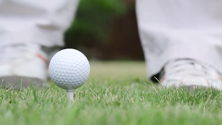 Golf player hitting golf ball. Close up of - Royalty Free St