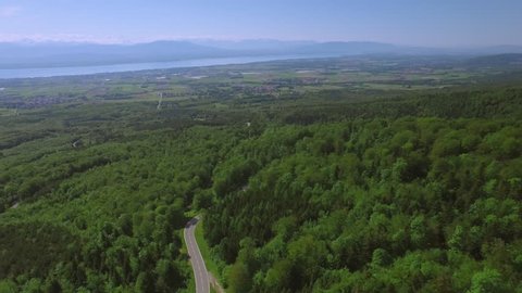Scenic road in Switzerland aerial shot / Flying over Lake Geneva area