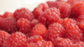 Pile of European raspberry red healthy fruit slow tilt 2160p 30fps UltraHD footage - Rubus idaeus natural vitamin and  antioxidant fruit culture 4K 3840X2160 UHD tilting video