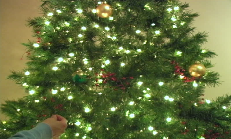 Woman decorating the christmas tree