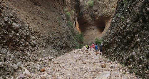 FREEDOM, UTAH - JUL 2016: Family hiking Box Canyon mountain dry river. Rock climbing world famous destination, Maple Canyon.Cliffs, challenging climbs day of adventure, recreation, sport and strength.