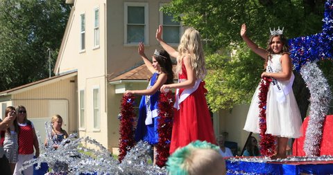 MORONI, UTAH - 4 JUL 2016: Little Mount Pleasant royalty float. Small rural community annual celebration. Family friends gather to cheer. Fun way to celebrate freedom and pride.