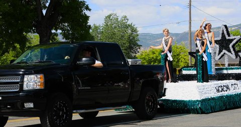 MORONI, UTAH - 4 JUL 2016: 4th July Moroni City Queen Royalty parade. Small rural community annual celebration. Family and friends gather to cheer. Fun way to celebrate freedom and pride.