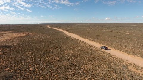 A Toyota Landcruiser Prado Travels on a dirt road in the outback of Western Australia, Gnaraloo, Western Australia