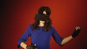 A cute woman wearing a virtual reality headset, playing an imaginary instrument (the air guitar). Medium close-up shot.
 - Powered by Shutterstock - Get 15% off with code: PIKWIZARD15