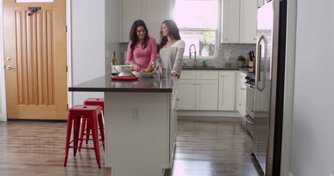Lesbian couple preparing meal together at home, full length, shot on R3D