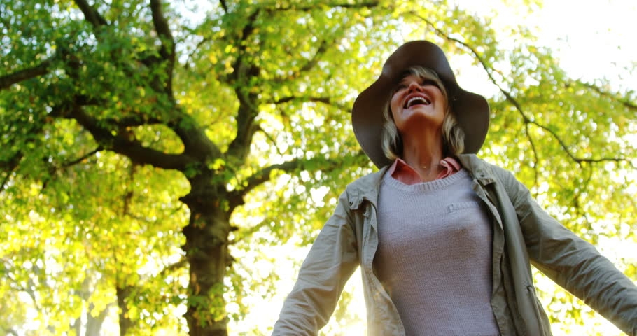Happy woman in park on sunny a day