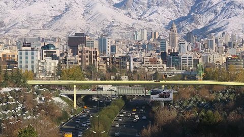 Tehran, Iran - December 8, 2015: Winter Tehran view with a snow covered Alborz Mountains on background
