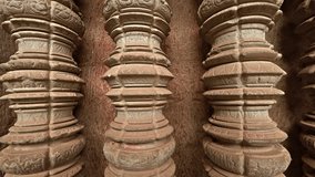 Ancient. round. hand carved columns stand in a wall niche in the main temple complex of Angkor Wat. in Cambodia. FullHD 1080p video