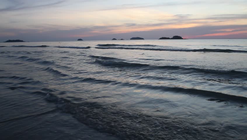 Sea waves at sunset