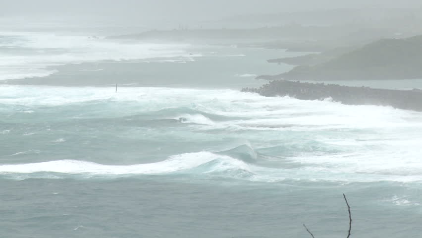 Sea storm waves crash ashore