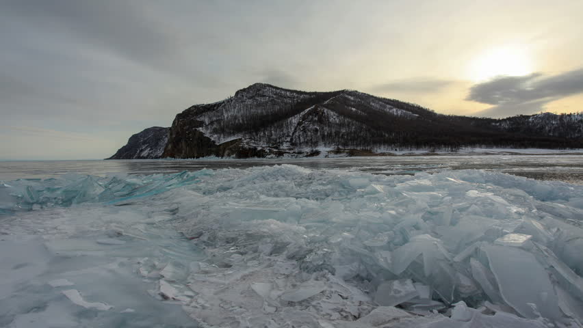 Sunset in the icy Lake Baikal on Olkhon Island, Lake Baikal, Irkutsk region, Russia. Full HD
