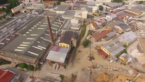 Camera flight over a industrial zone with construction site. Industry and investment in European Union.