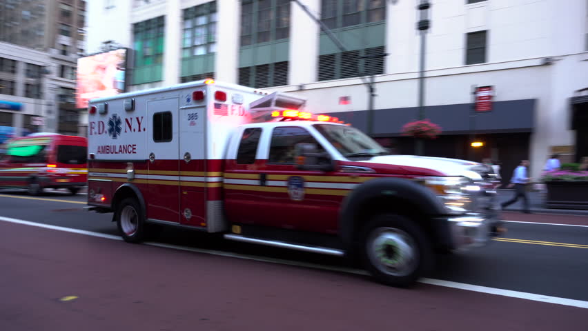 New York City - July 2016: FDNY ambulance speeds to a medical emergency through midtown Manhattan during the morning commute hours. | Shutterstock HD Video #17949382