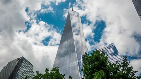 New York City, USA - July 05: Time lapse view of architectural landmark One World Trade Center, the tallest building in the Americas, located in Manhattan, New York City, United States.