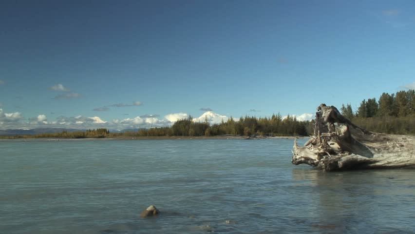 Zoom In Over Flowing River to Mt. McKinley