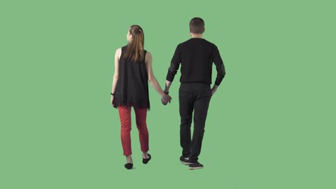 Young couple in casual clothes are slowly strolling away from the camera. The camera is static. Lens 85 mm. Footage with alpha channel. File format - .mov, codec PNG+Alpha