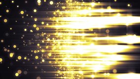 Background gold movement.Gold particles with rays on a black background. VJ Seamless loop.