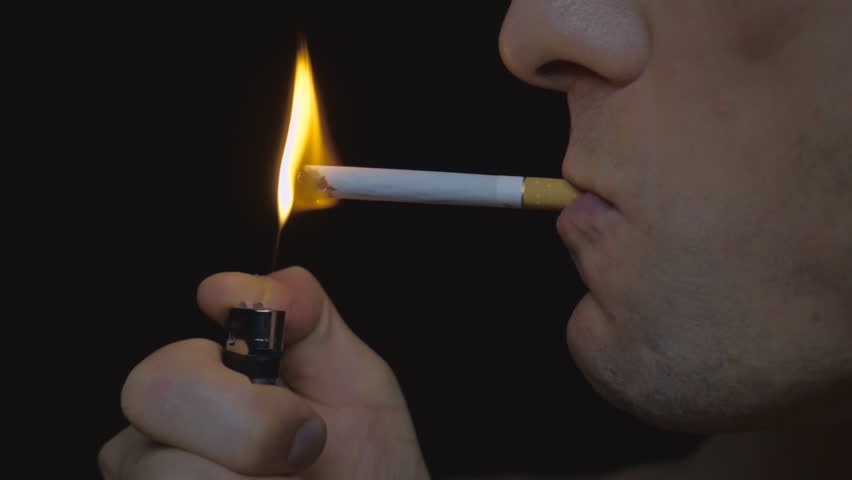 Man ignite the lighter and light a cigarette and blew smoke. Closeup. Slow motion, high speed camera, 250fps | Shutterstock HD Video #17972269