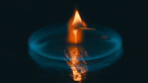 A lit match is fall down and ignites the gasoline. Blue wave at the forefront of fire go to meet. S-log - High Dynamic Range. Slow motion, high speed camera, 250fps