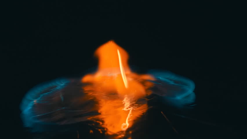 A lit match is fall down and ignites the gasoline. Blue wave at the forefront of fire go to meet. S-log - High Dynamic Range. Slow motion, high speed camera, 250fps