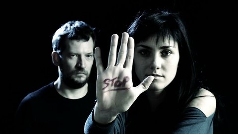 Concept of stop to violence on women with woman and man