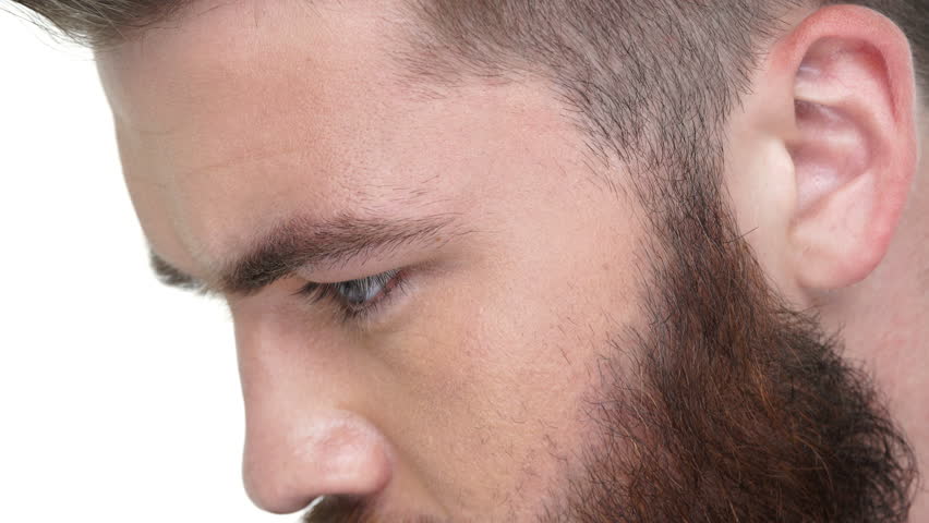 Side view of a bearded handsome man looking forward