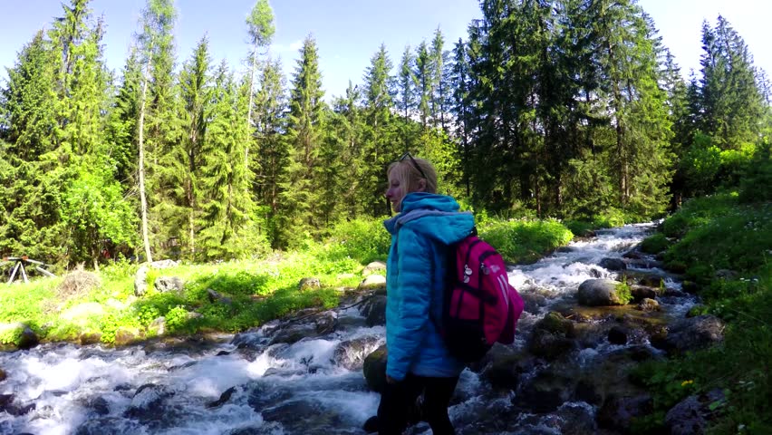 Woman Hiking By the River 스톡 동영상 비디오(100% 로열티 프리) 17980039 | Shutterstock