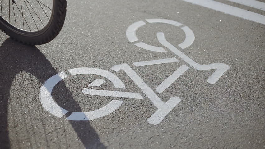 Bicycle road sign on asphalt. Leisure activities | Shutterstock HD Video #17981680