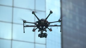 Six Rotor Drone with Camera on Gimbal flying in the Sky. Shot in Slow motion. 