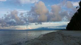 A clip from the white sand beaches of Siquijor, shot during early morning hours.cumulus clouds can be seen over the ocean. Presented in real time and originally shot in 4K (Ultra HD) resolution.
