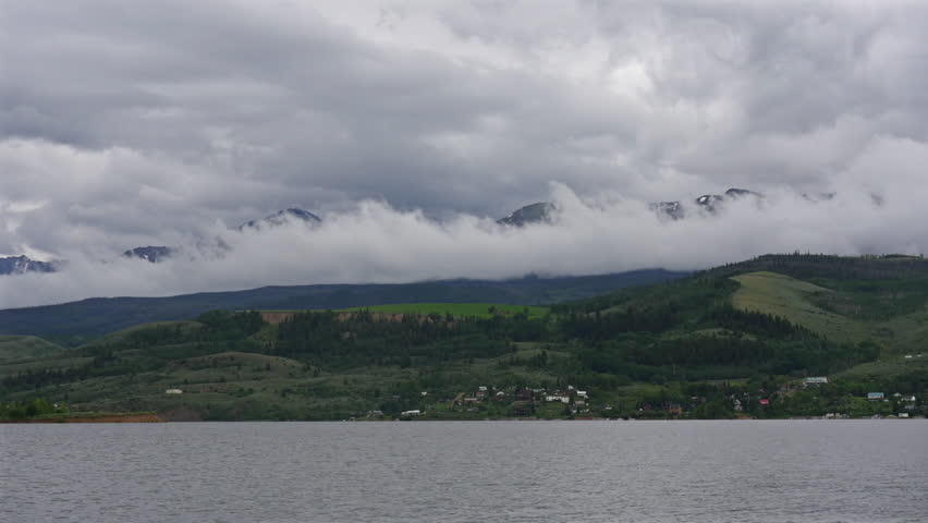 Rolling Clouds over Mountains and Lake Timelapse