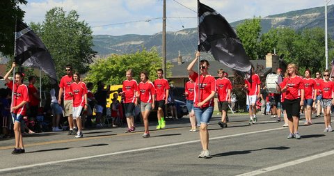 MORONI, UTAH - 4 JUL 2016: 4th July Parade North Sanpete High School Band. Fourth American celebration freedom rural town. Values and family. Patriotic, high school band, royalty floats, fire trucks.