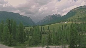 Amazing view from drone of mountain forests and fields in Dolomites, Italy Alps