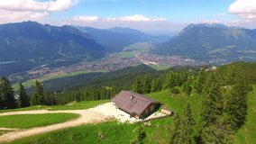 Camera flight over high mountain range. Video from drone. Alpine landscape near Garmisch Paterkirchen in Germany. Amazing places in Central Europe. Destination for hiking, skiing and mountaineering.