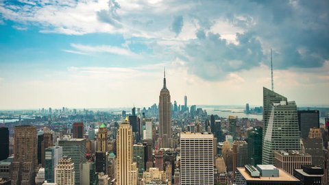 Time lapse view of New York City skyline including architectural landmark Empire State Building in Manhattan, New York, United States.