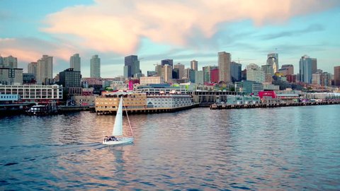 Sailboat crosses water by Seattle skyline 2